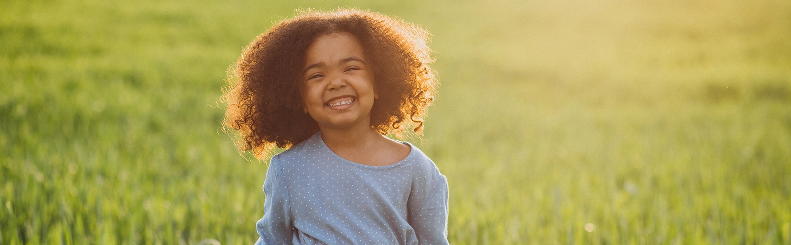 cute-african-baby-girl-field-sunset 1